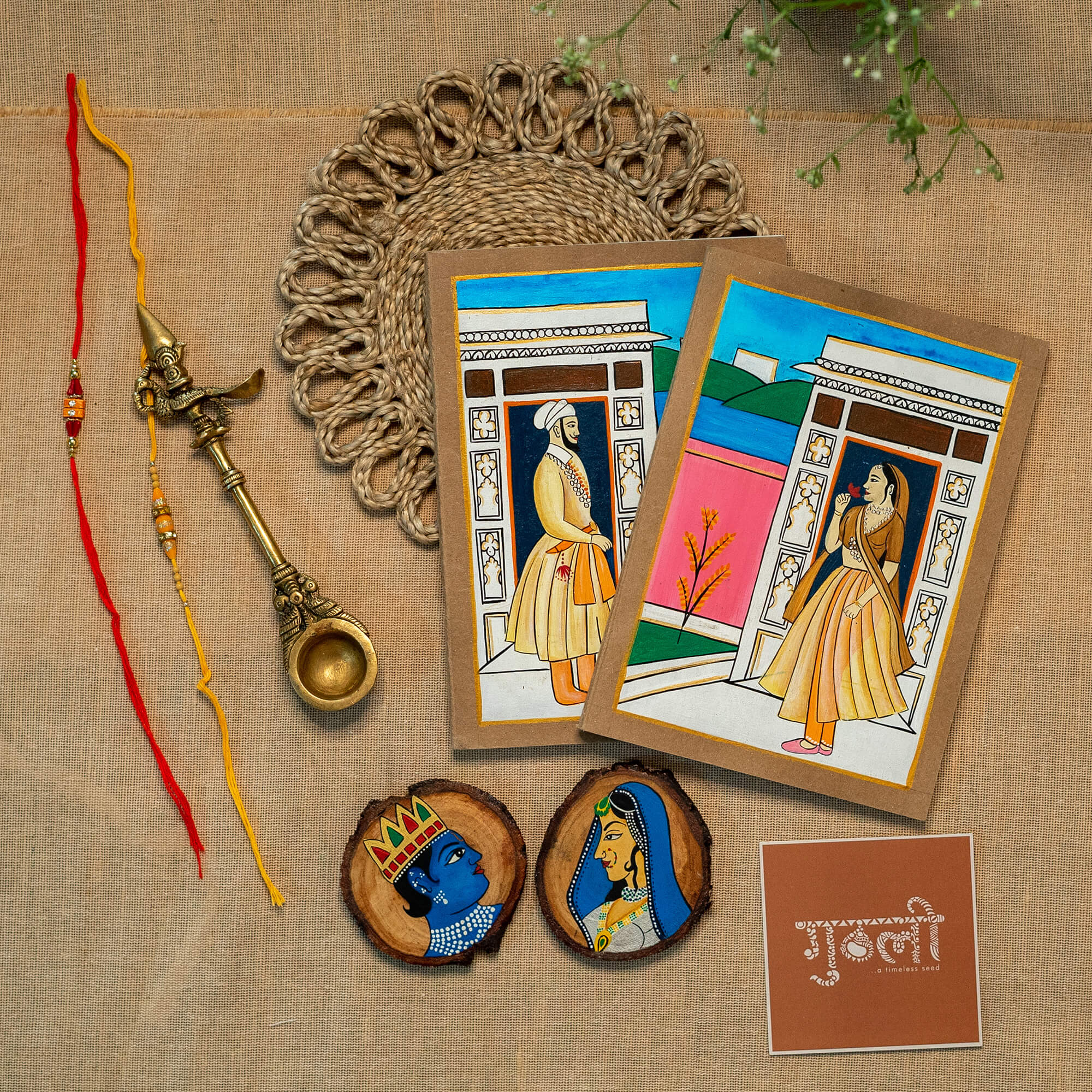 Set of 2 Handcrafted Diary and 2 Wooden Coaster paired with 2 Rakhi ( COMBO 6 )